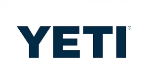 L'image présente le logo YETI en lettres majuscules bleu marine sur fond blanc. Le symbole de marque déposée (®) est situé au-dessus du coin supérieur droit de la lettre « I ».